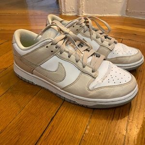 Tan and white Nike Dunks.